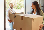Happy couple, boxes and moving in new home, property or real estate renovations together indoors. Man and woman with smile in happiness for mortgage loan, investment or asset carrying packages inside