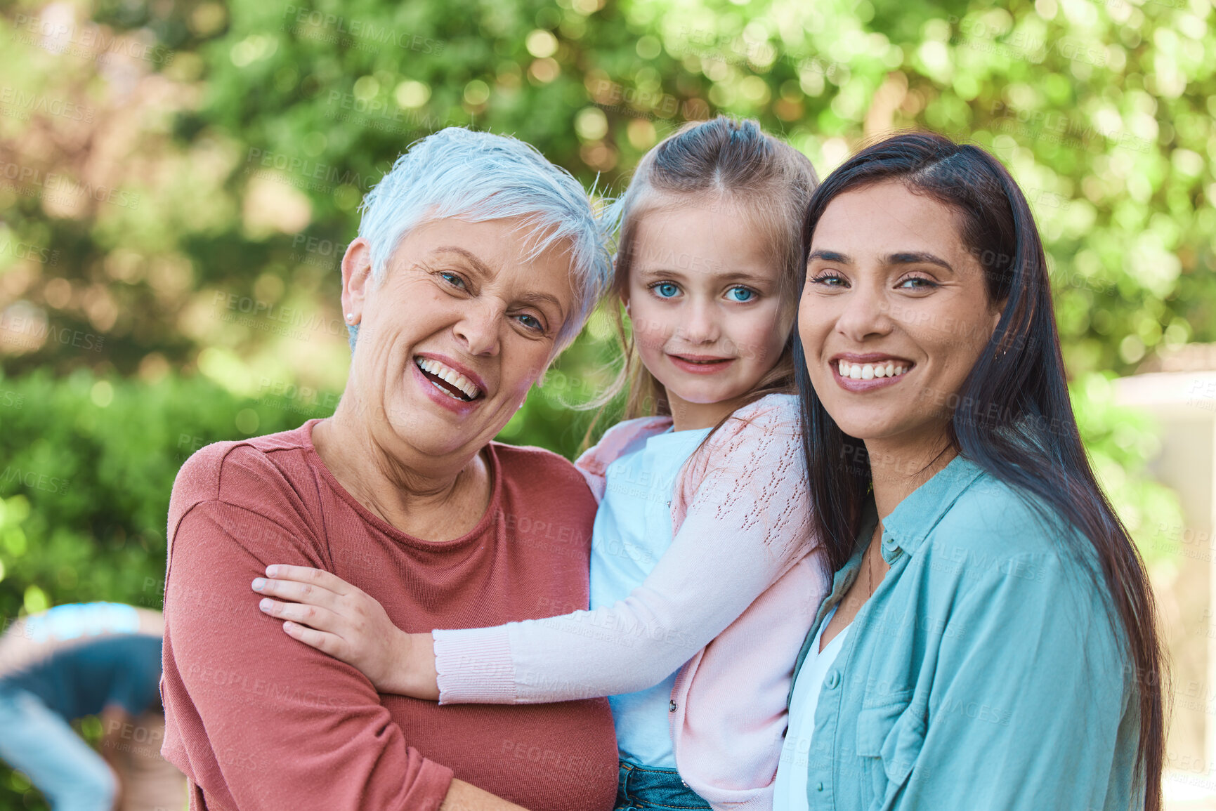 Buy stock photo Family, women and portrait in a garden with love, hug and happy while bonding outdoors. Face, smile and girl with mother and grandmother in a park, embrace and enjoying the weekend outside together