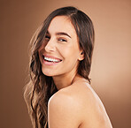 Portrait, hair and happy woman in studio for beauty, treatment and cosmetics on brown background. Haircare, face and girl smile for natural, curly or wavy, texture or keratin, shine and confidence