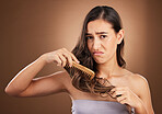 Hair care, damage and portrait of sad woman with comb, studio background and problem in salon treatment. Haircare crisis, mockup and frustrated latino model with split ends, dry or damaged hairstyle.