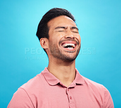 Buy stock photo Laughing, funny comedy and man in studio isolated on a blue background. Comic, humor and male person laugh at joke, laughter and happiness, cheerful and carefree for hilarious smile, excited or emoji