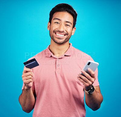 Buy stock photo Man with smartphone, credit card and happy in portrait, ecommerce and fintech isolated on blue background. Online shopping, internet banking and finance, technology and male with bank app in studio