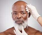 Skincare, needle and portrait of black man with collagen, injection and professional anti ageing spa treatment.  Dermatology, cosmetic process and mature model with hands on dermal filler syringe.