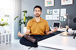 Yoga, office and business man in lotus pose for mental health and breathing exercise at a desk. Corporate, meditation and asian guy manager meditating for stress management, zen and peace in Japan