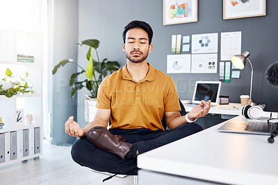 Buy stock photo Yoga, office and business man in lotus pose for mental health and breathing exercise at a desk. Corporate, meditation and asian guy manager meditating for stress management, zen and peace in Japan