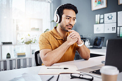 Buy stock photo Thinking, laptop and headphones on business man listening to music, audio or webinar. Asian male entrepreneur with technology for planning strategy, idea or reading email or communication on internet