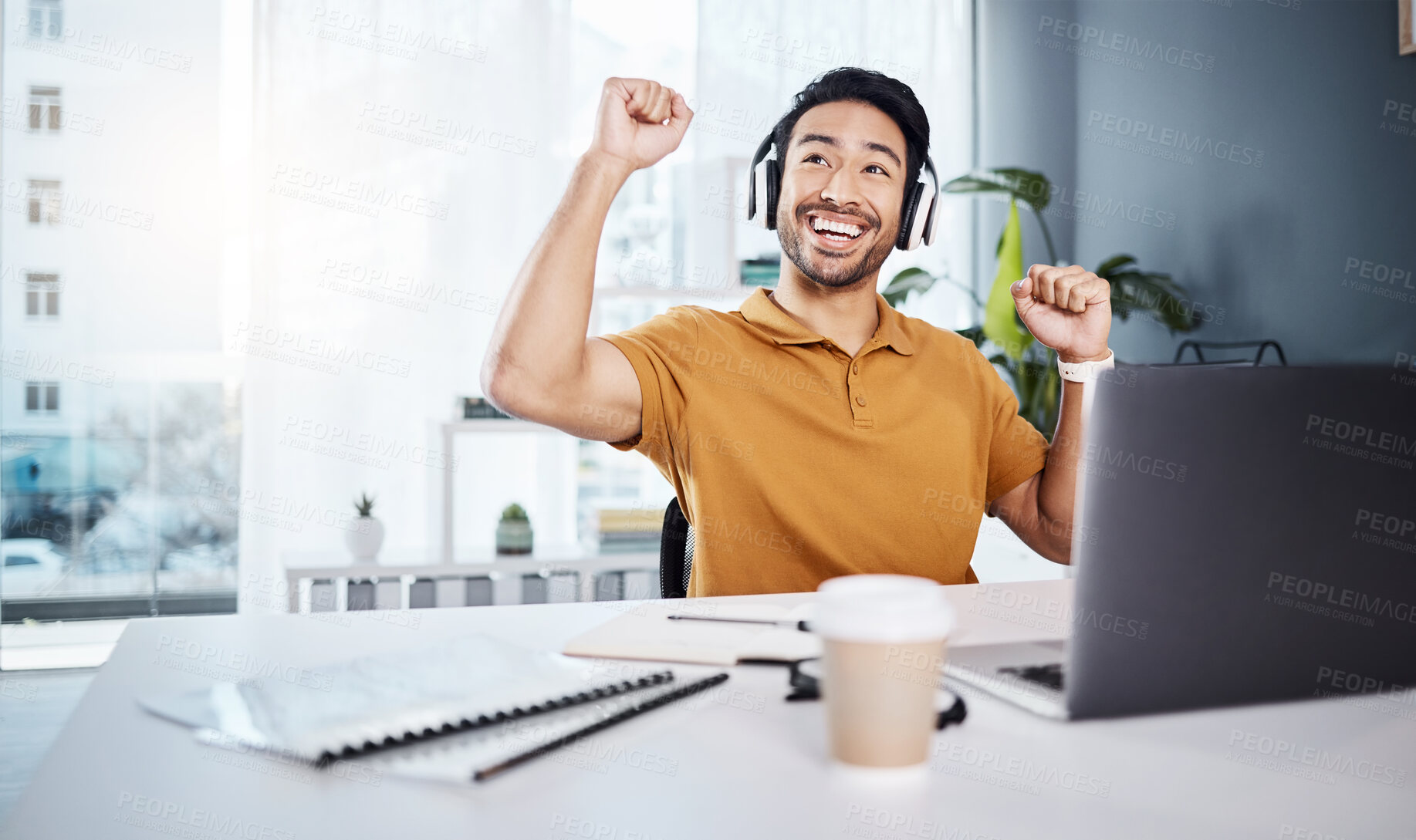 Buy stock photo Laptop, headphones and business man celebrate success while listening to music, audio or video call. Excited asian male entrepreneur at desk with smile and hands for achievement, win or goals