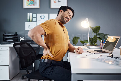 Buy stock photo Back pain, business man and stress at night at office desk with injury and health problem. Asian male entrepreneur with technology, mental health or burnout while tired or fatigue and working late