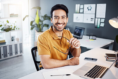 Buy stock photo Happy, smile and portrait of a businessman in the office while working on a project with a laptop. Confidence, leadership and professional male employee planning a company report in the workplace.