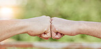 Closeup of people, hands and fist bump for success, teamwork and greeting outdoors. Friends, community and bumping hand for collaboration, motivation and trust of solidarity, support and cooperation