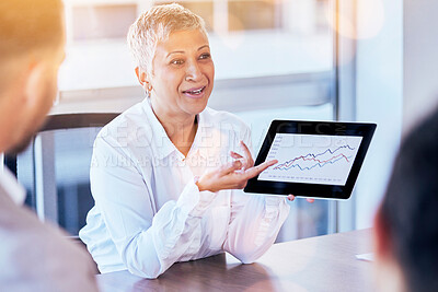 Buy stock photo Senior business woman, tablet and data of graph, chart or statistics in meeting at corporate office. Mature female manager showing company investment, profit or annual target and results at workplace