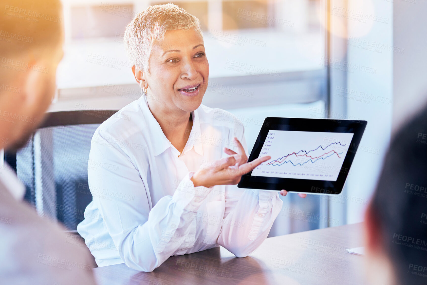 Buy stock photo Senior business woman, tablet and data of graph, chart or statistics in meeting at corporate office. Mature female manager showing company investment, profit or annual target and results at workplace