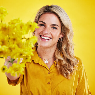 Buy stock photo Portrait, smile and woman showing flowers in studio isolated on a yellow background. Floral, bouquet present and happiness of person or female model sharing natural plants and fresh flower for spring