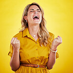 Woman, fist celebration and shout in studio for winning, goals or success with happiness by yellow background. Girl, happy and winner with crazy screaming for bonus, profit or prize from competition