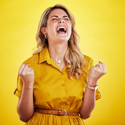 Buy stock photo Woman, fist celebration and shout in studio for winning, goals or success with happiness by yellow background. Girl, happy and winner with crazy screaming for bonus, profit or prize from competition