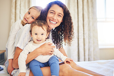 Buy stock photo Portrait, family and children smile with mother in home, bonding and having fun together. Happiness, bedroom and baby, girl and mama enjoying quality time with love, care and relax on bed in house.