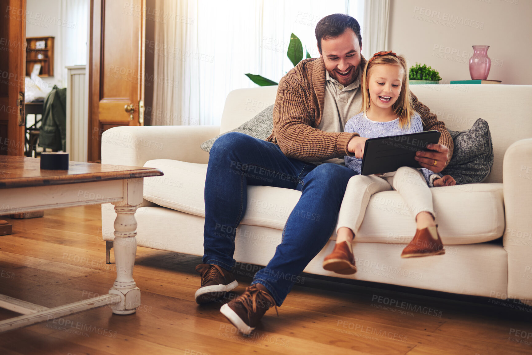 Buy stock photo Father, child and a tablet for learning in a family home while happy and excited for education internet. A man or dad and girl kid on the sofa for streaming, mobile app and website for development 