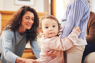 Buy stock photo Portrait, family and baby with wellness, support and happiness at home, relax and fun. Face, child and infant with a smile, cheerful and quality time with bonding, parents and toddler in living room