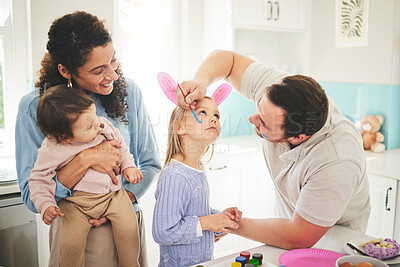 Buy stock photo Art, creative and happy with family and face painting for celebration, holiday and bonding. Easter, color and party with children and parents with bunny ears at home for happiness, vacation or relax 