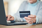 Laptop, credit card and hands typing for online shopping, digital banking or payment in home. Computer, ecommerce and woman on internet for sales, finance or fintech purchase, savings or investment.