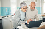 Laptop, elderly couple and coffee in kitchen, internet browsing or social media in home. Computer, retirement and man and woman reading email, news or streaming video, movie or film together online.