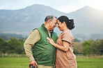 Senior couple, love and outdoor in nature with care, support and commitment to happy partner. Elderly man and a woman on a grass field or countryside for travel, adventure and retirement vacation