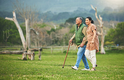 Buy stock photo Senior couple, walking and outdoor in nature with love, support and commitment to happy partner. Elderly man and a woman on a grass field or countryside for travel, adventure and retirement vacation