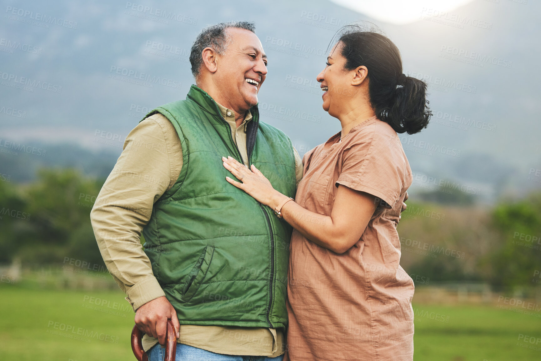 Buy stock photo Nature, laughing and senior couple outdoor in with love, care and commitment to happy partner. Elderly man and a woman on a grass field or countryside for travel, adventure and retirement vacation