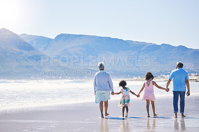 Buy stock photo Walking, holding hands and grandparents at the beach with children for holiday and together by the sea. Back, summer and girl kids on a walk by the ocean with a senior man and woman for bonding