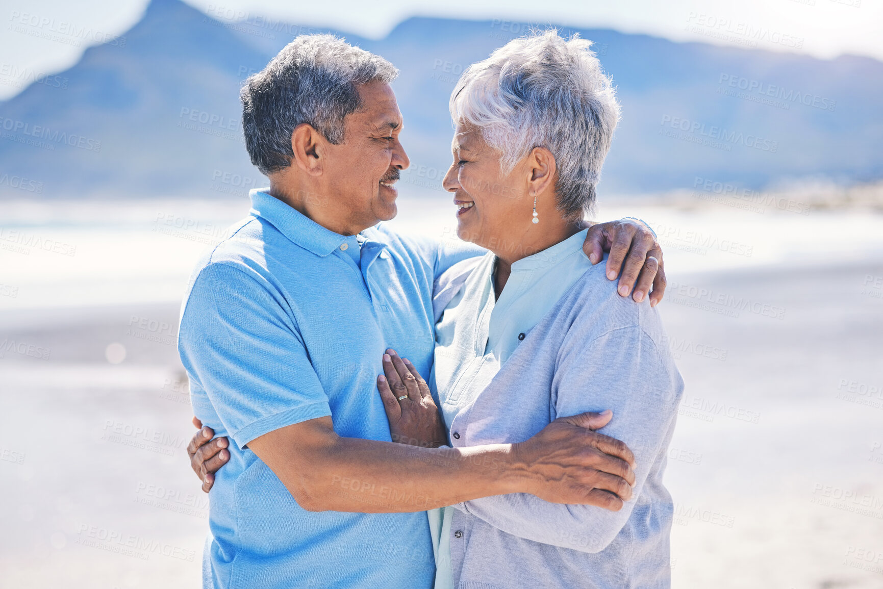 Buy stock photo Senior couple, hug and sea vacation outdoor with love and romance in nature. Ocean, elderly and old woman and man together on summer holiday by the sea feeling happiness and relax on a beach