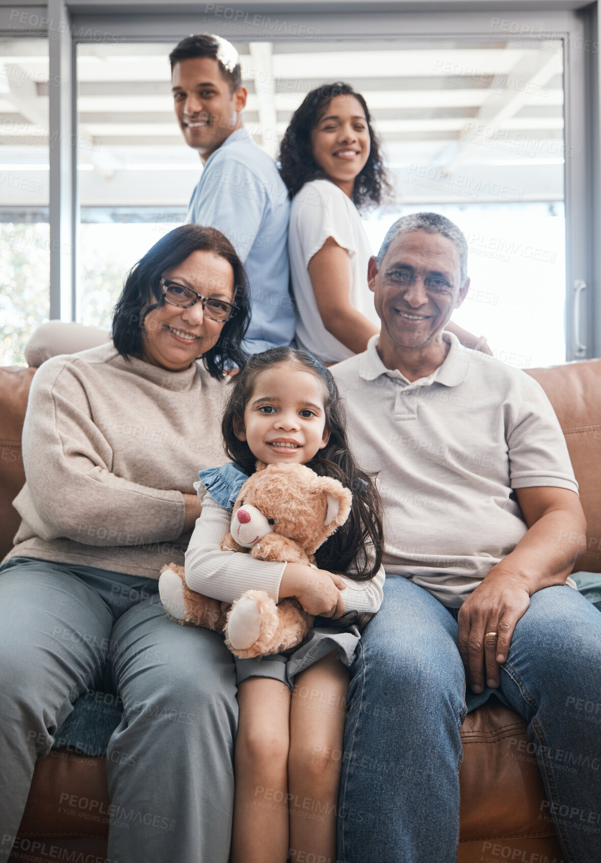 Buy stock photo Big family, portrait and couch with grandparents, child and happiness in a living room lounge. Happy, love and parent care of a mom, dad and kid with elderly people relax on a sofa in a home