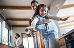 Portrait, father and girl with a smile, airplane and love at home, playing and cheerful together. Face, family and happy dad with daughter in the air, parents and fantasy with swing for plane games