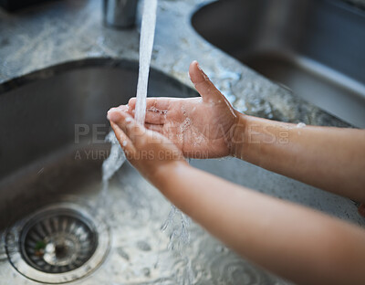 Buy stock photo Child, hands and washing for clean hygiene, health and wellness with water in the kitchen. Hand of kid rinsing or cleaning with soap under running tap in basin to remove bacteria, virus or germs