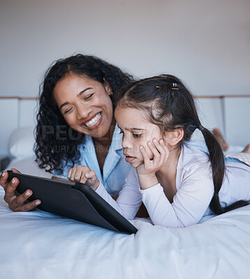 Buy stock photo Tablet, mother and girl relax on bed in home bedroom, social media or online browsing. Technology, happiness and mom and child with touchscreen for learning, streaming film or video together in house
