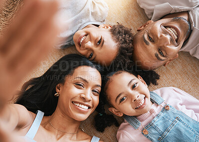 Buy stock photo Family, selfie portrait and top view smile, bonding or having fun together. Parents, happiness above and children relaxing or lying on carpet floor with profile picture, face or enjoying time in home