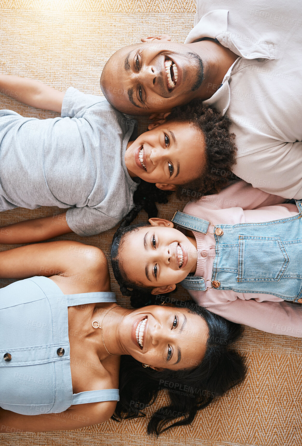 Buy stock photo Family, portrait and top view smile on carpet, bonding or having fun together. Parents, happiness above and children relaxing or lying on floor with man and woman, care or enjoying time in home.