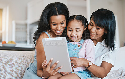 Buy stock photo Family, tablet and child on a children education app with mother and grandparent at home. Happiness, bonding and kid game on technology with a young girl smile from mom and grandmother help on couch