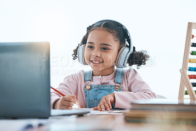 Buy stock photo Online education, laptop and headphones of child in e learning, language translation and writing in virtual class. Happy kid with audio technology, computer and English development or numbers at home