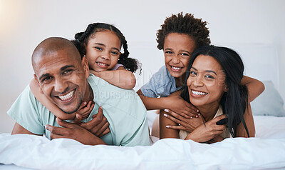 Buy stock photo Portrait, family and smile in home bedroom, bonding and relaxing or lying together. Bed, happiness and children with mother and father or parents enjoying quality time, having fun and care in house.