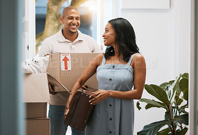 Buy stock photo Happy couple, real estate and moving in new home with box for property investment or relocation together. Man and woman realtor carrying boxes or luggage in the house with smile for mortgage loan