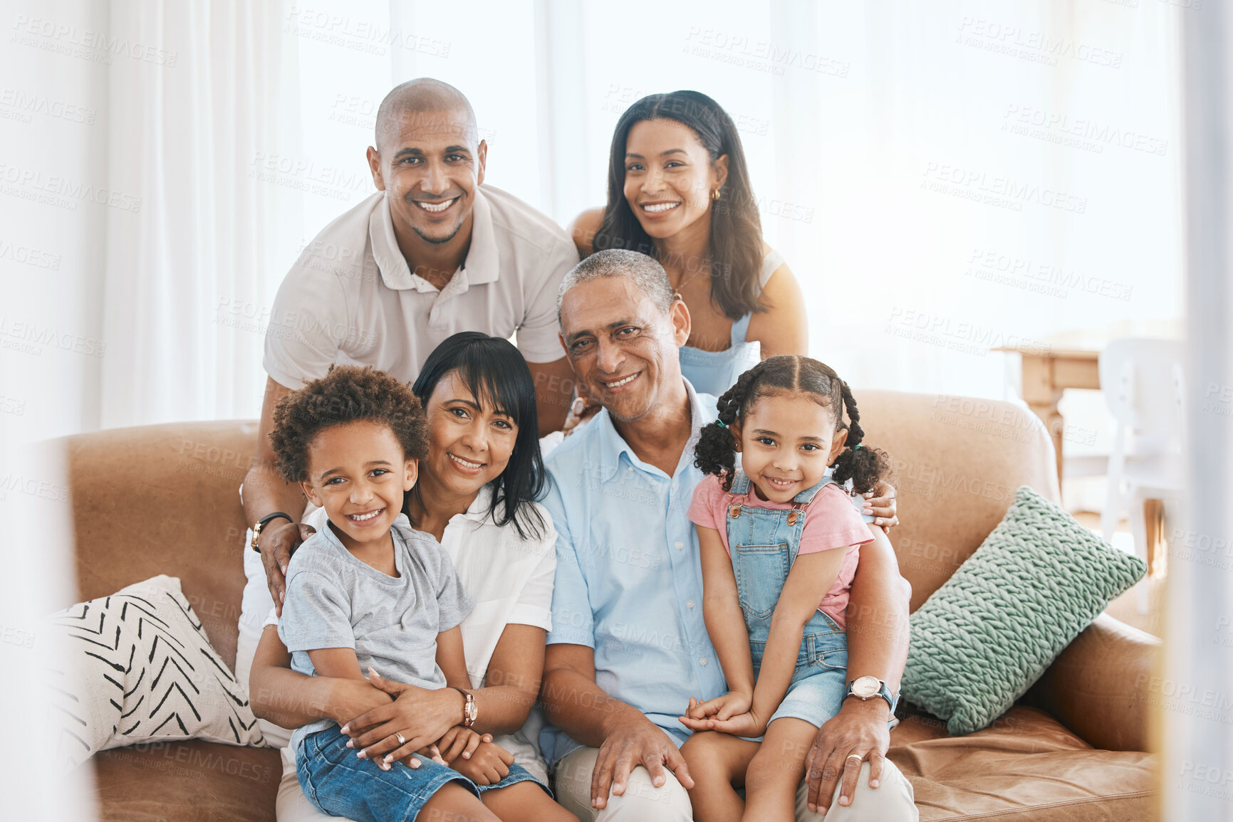 Buy stock photo Portrait, big family and smile in home on sofa, bonding or having fun in living room. Grandparents, parents and happiness of children, care and enjoying quality time together on couch in lounge.