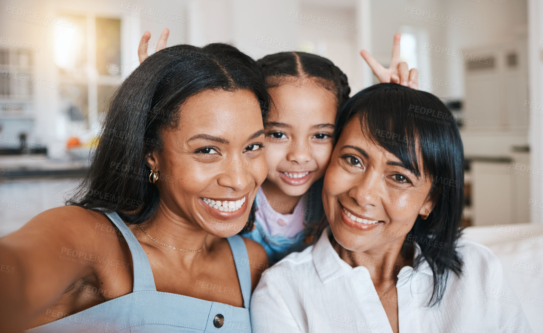 Buy stock photo Peace sign selfie, grandmother and child with mother in home living room, bonding or having fun. Family, smile and portrait of girl with grandma and mom, face or take photo with v hand emoji together