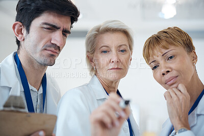 Buy stock photo Doctor, serious team and thinking in strategy or healthcare for schedule planning or brainstorming ideas at hospital. Group of thoughtful doctors in teamwork collaboration contemplating medical plan
