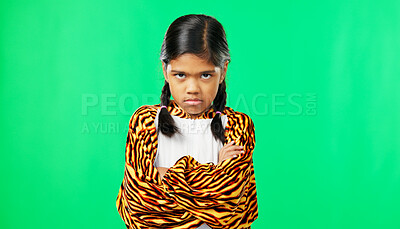 Girl child, angry face and green screen studio with arms crossed, refuse or shake head in tiger pyjamas. Frustrated kid, anger or portrait for mock up with mad, tired or bored expression by backdrop