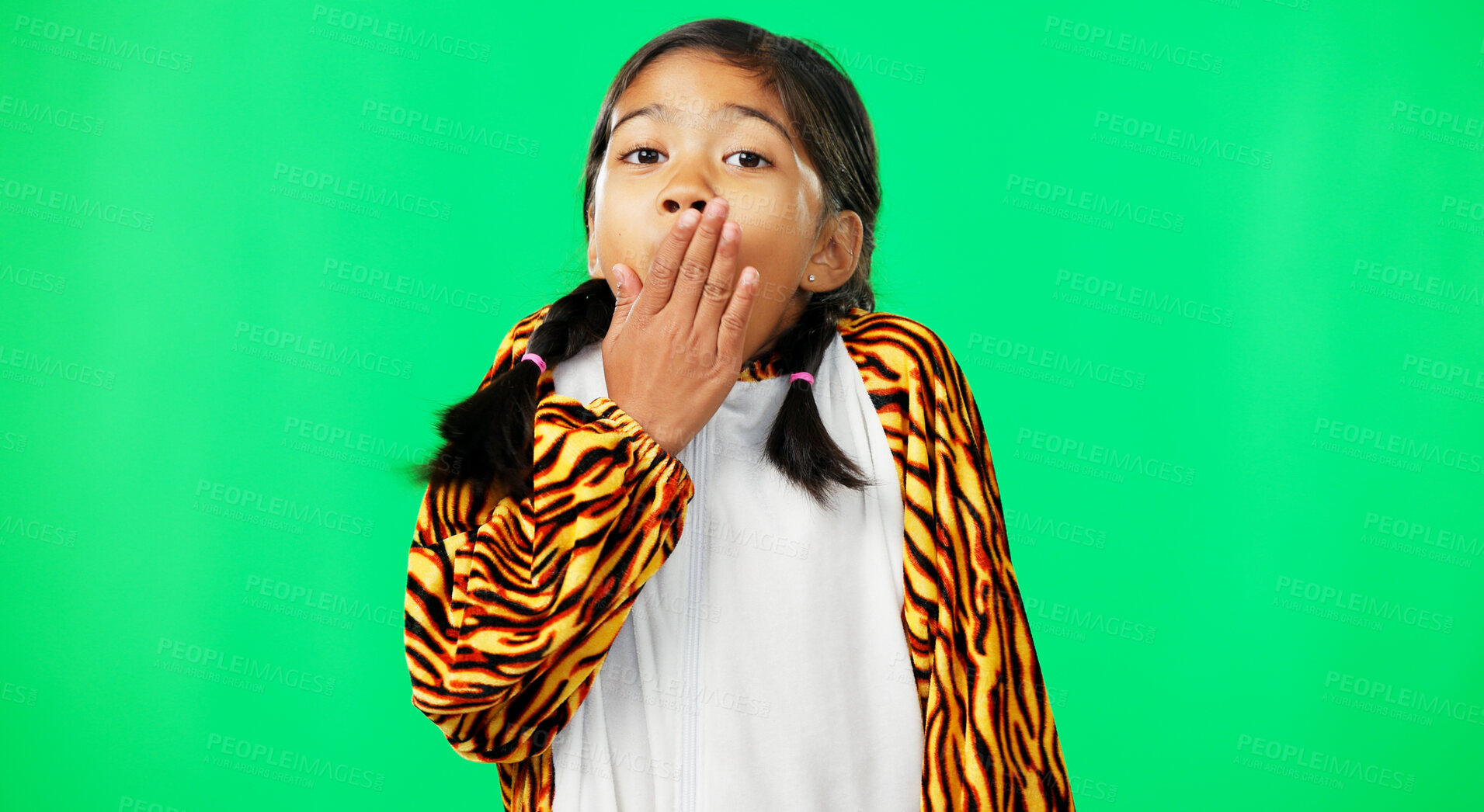 Buy stock photo Girl, shock and hands on mouth with green screen, face portrait and tiger clothes by mockup. Female kid, news announcement and facial meme with surprise in studio, advertising and fun in youth