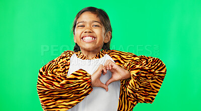 Buy stock photo Girl child, heart sign and green screen with smile, tiger suit pyjamas and love by studio background. Kid, mock up and animal clothes with v icon, emoji and happy with symbol, portrait and kindness