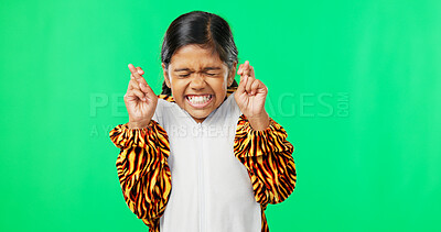 Hope, excited and a girl with a gesture on a green screen isolated on a studio background. Wish, hopeful and a child with excitement, hoping and making a wish with fingers crossed on a backdrop
