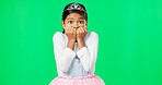 Scared, fear and child with anxiety on green screen with crown, princess costume and tutu in studio. Stress, worry mockup and isolated young girl with worried, sadness and anxious facial expression