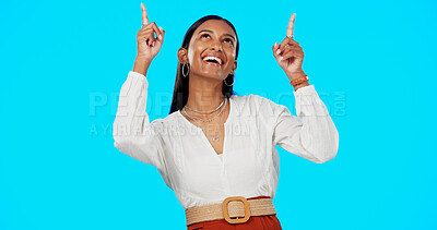Buy stock photo Advertising studio, happy and woman pointing up at service deal news, commercial promo or branding. Retail information, sales discount choice and model notification announcement on blue background