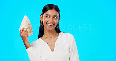Buy stock photo Money, fan and happy woman in studio with savings, budget or financial investment of bonus salary. Smile, banking and girl with cash lottery prize, tax exchange or income profit on blue background.